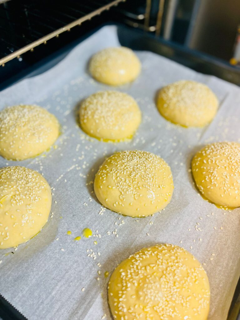 hamburger buns going in the oven